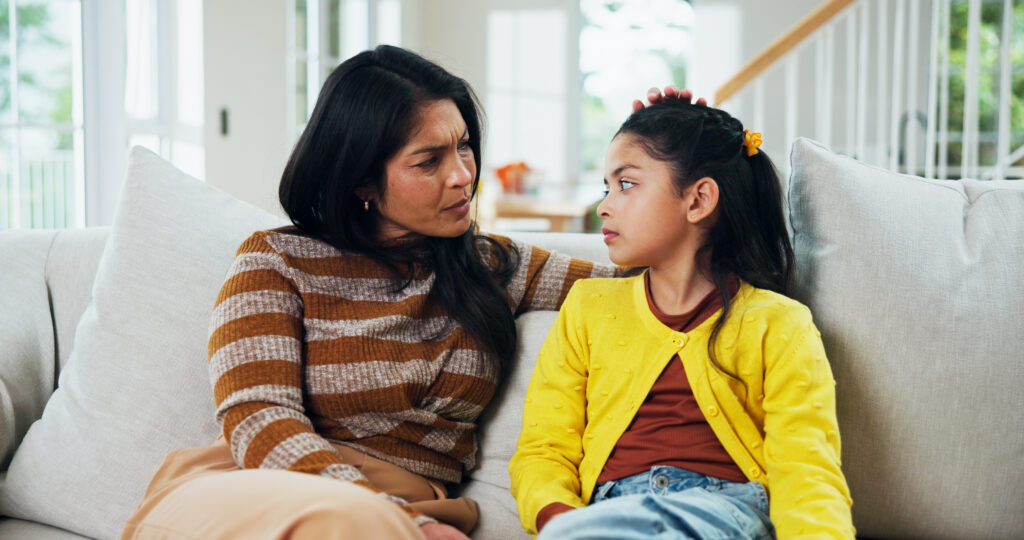 mother talking to her daughter