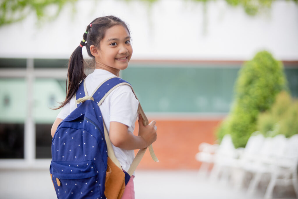 small girl with a backpack