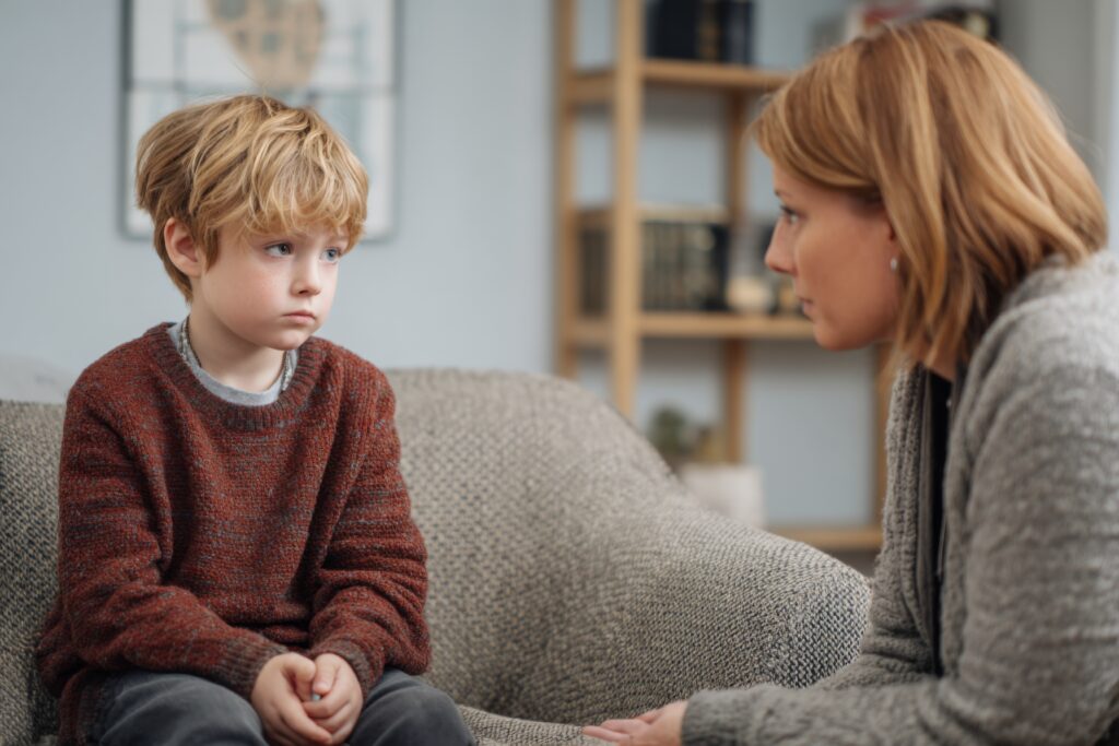 a mother talks gently to her child