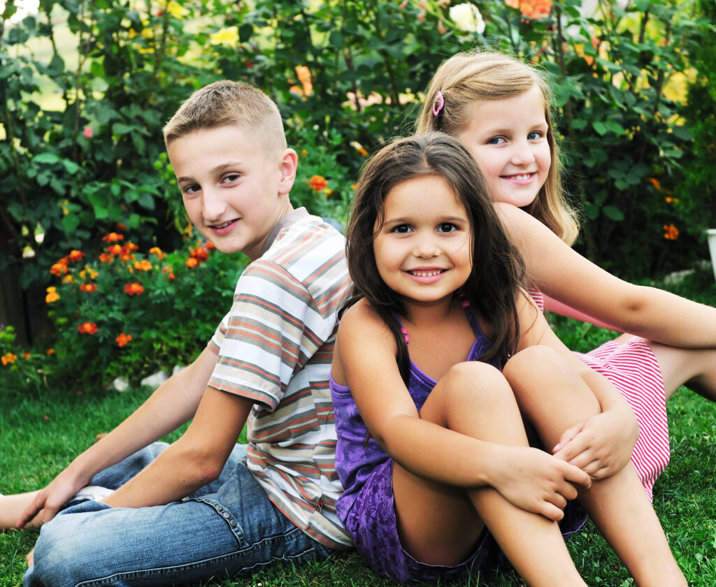 happy kids sitting outside