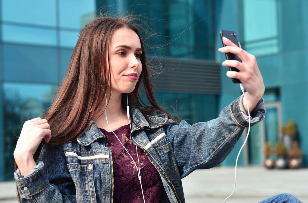 teenage girl taking a selfie